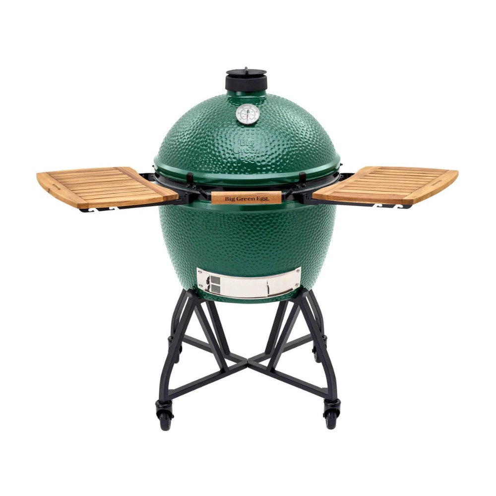 1fcab4e1-811d-4d80-a29e-833ecef61cd9.jpg Green ceramic grill with wooden side shelves and a temperature gauge, designed for versatile outdoor cooking.