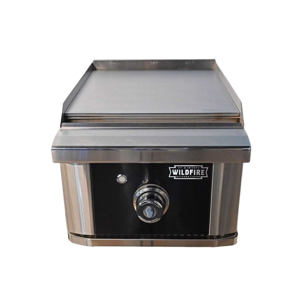 2f4ba606-d64c-4c13-bffa-920b67bc42e8.jpg Stainless steel outdoor griddle with a smooth cooking surface and a control knob, featuring the Wildfire brand logo.